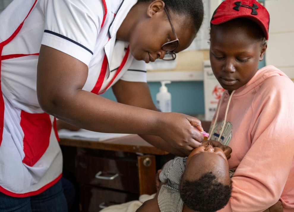 Child receiving routine childhood immunizations including Polio, Rotavirus, Pentavaliant and PCV10 at Babadogo Level 3 Hospital in Nairobi, Kenya.